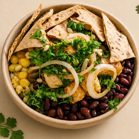 Mexican Bean Fiesta Bowl with black beans, sweet corn, paneer, onion and tortilla chips